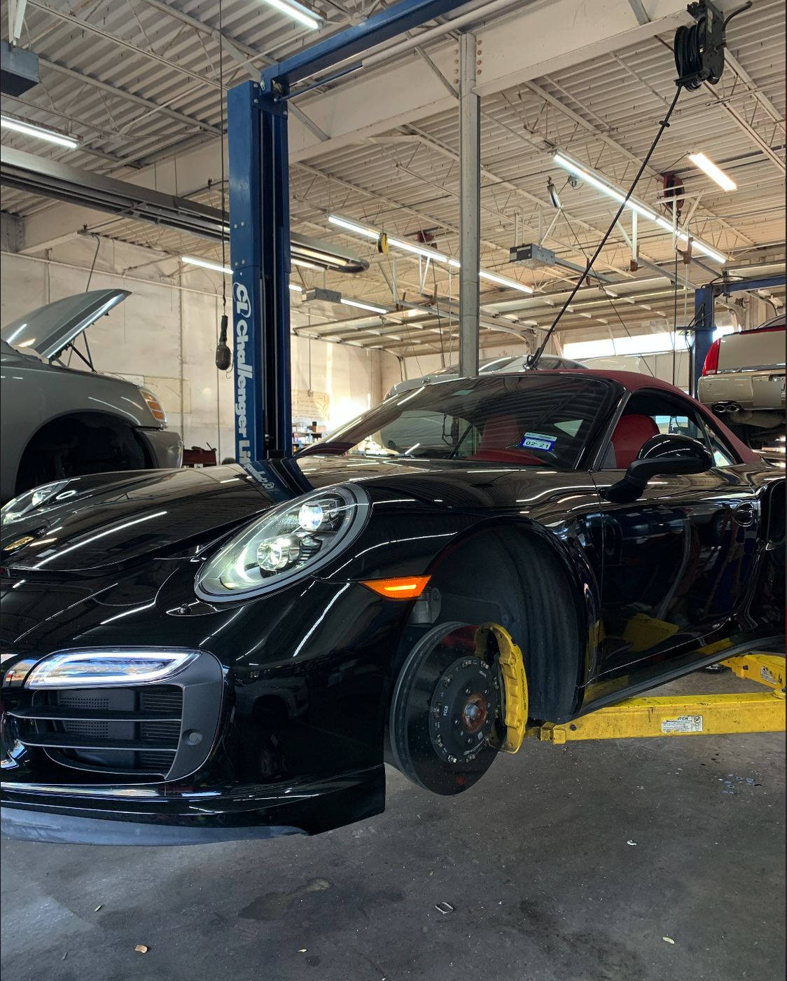 Porsche on the lift at Missouri Car Care